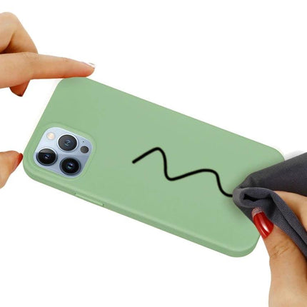 Silicone Phone Case For Daily Use, Slim Protective Cover For Everyday Phone Handling On The Go — slim green silicone case being wiped, shows soft flannel interior