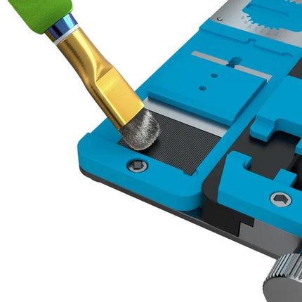 Mijing Steel Brush with Colorful Handle for IC Pad Cleaning brushing glue and tin residue from a motherboard pad near a blue fixture