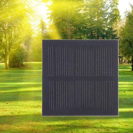 DIY Solar Panel Module for Educational Projects and Battery Charging on grass in sun for student experiments