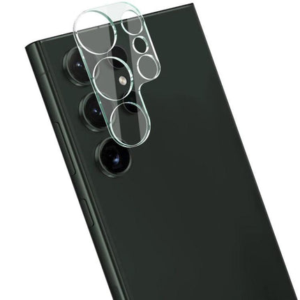Imak High Definition Glass Lens Film for Phone Protection showing clear dual-layer camera lens protector being applied to a black phone