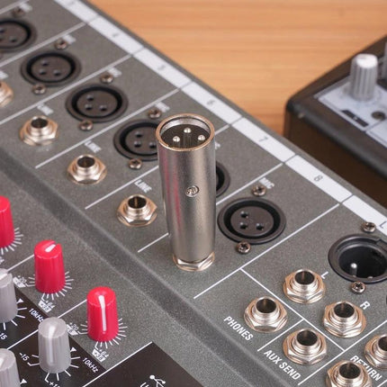 Cable Connector for Home Audio Systems and Performances showing XLR to 1/4 adapter plugged into a mixing console for clear balanced signal