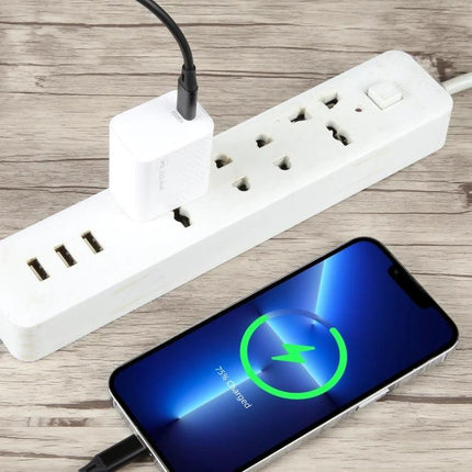 Handy Travel Charger for Daily Device Needs on the Go compact white charger plugged into power strip charging smartphone on the move