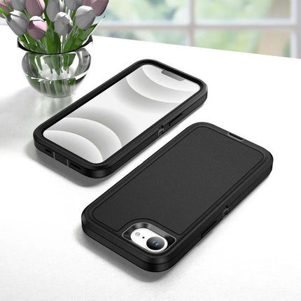 Rugged iPhone Case For Daily Use And Travel - black three-layer protective case on table showing front and back, raised edges and camera protection