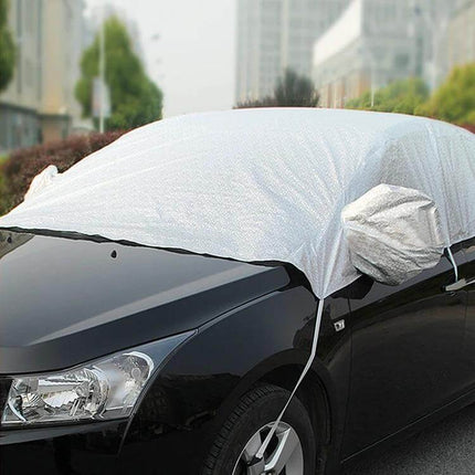 Aluminum Foil Car Sun Cover for UV and Heat Protection draped over windshield and mirrors to block sunlight and reduce interior heat