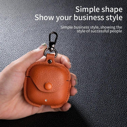 Protective Leather Case for Everyday Earphone Storage in brown PU leather keychain pouch held in hand, compact scratch‑resistant design