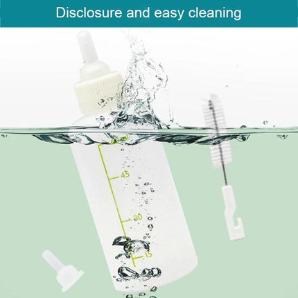 Daily Feeding Bottle Set for Kittens and Puppies with Essentials - clear 45ml bottle being rinsed with cleaning brush and spare nipple, easy cleaning demonstration