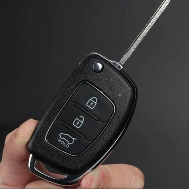 Hyundai 3-Button Folding Car Key Shell with Silver Edge shown in hand, black ABS housing with lock/unlock/trunk buttons