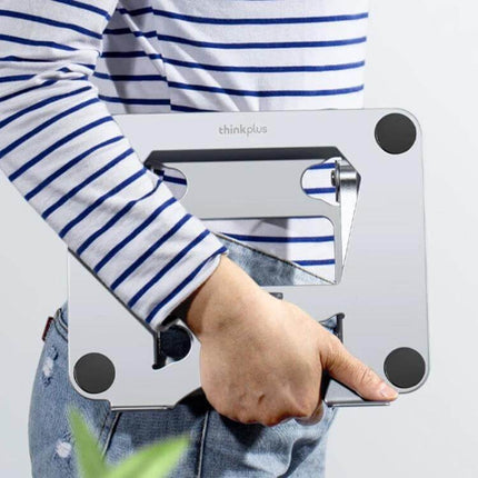Lenovo Thinkplus Adjustable Desktop Laptop Holder carried by hand, carbon steel ABS build for elevating laptops up to 20kg