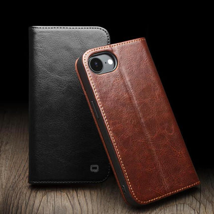 QIALINO Genuine Leather Phone Case With Built In Stand For Daily Protection On The Go brown leather folio showing camera cutout and black case background