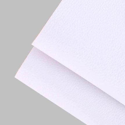 Self-Adhesive Leather Repair Patch 30 x 137 cm For Sofa And Car Seat white PVC leather sheet close-up, textured self-adhesive repair material
