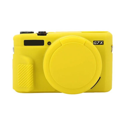Soft Silicone Protective Case with Lens Cover for Cameras shown on a yellow Canon PowerShot G7X Mark II camera — soft stretchable silicone, lens cap attached