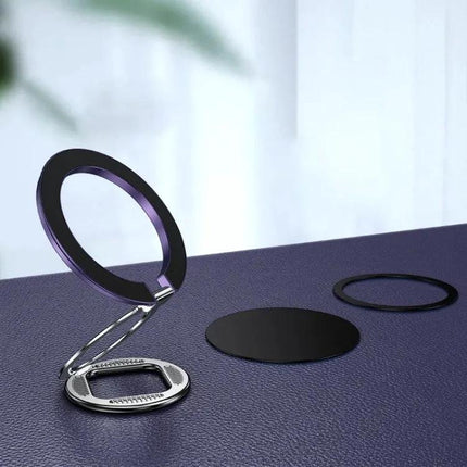 Adjustable Folding MagSafe Magnetic Ring Buckle Holder on table showing folded ring stand and magnetic plates for hands-free phone use
