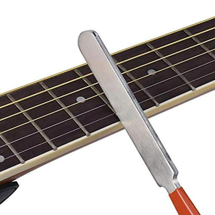 Guitar Maintenance Tool for Everyday Instrument Care stainless steel string cleaner and nut file on acoustic fretboard