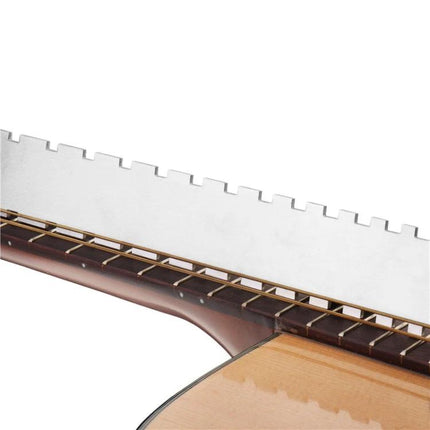 Handy Tool for Guitar Maintenance and Everyday Adjustments — stainless steel nut and string slot gauge on acoustic guitar neck