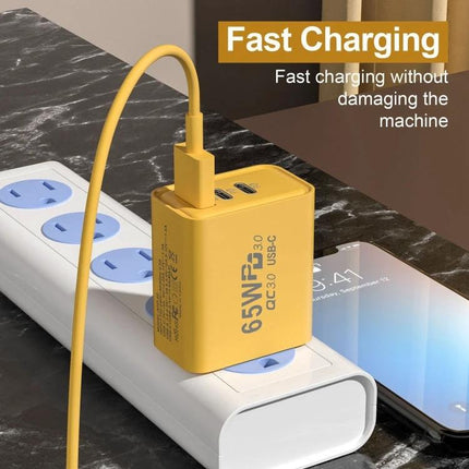 Essential Charger for Daily Device Needs at Home or Travel - compact yellow 65W PD fast charger powering phone and tablet on power strip
