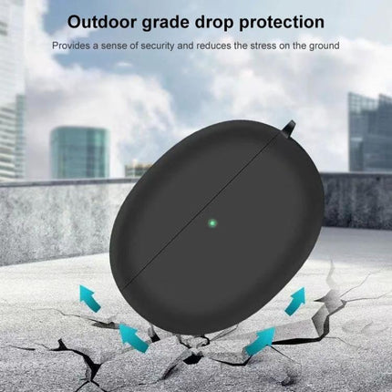 Silicone Case for Protecting Earphones in Daily Activities black silicone anti-shock pod on cracked concrete showing drop protection