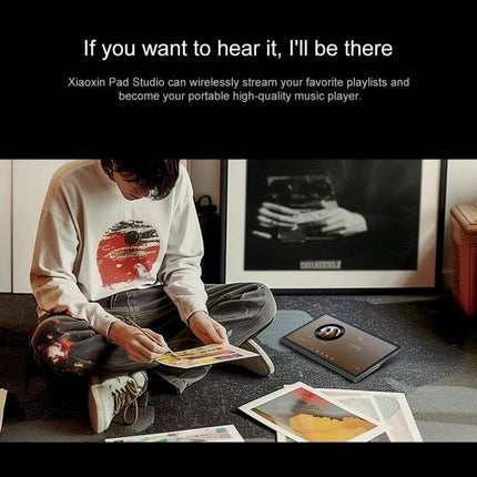 Lenovo Xiaoxin Pad Studio 11.5-Inch WiFi Tablet with 8GB Memory shown near a user streaming music and sketching on the floor