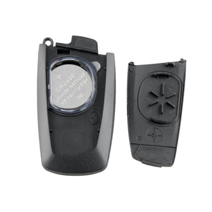 Complete BMW CAS4 Remote Car Key with Integrated Battery and Chip - replacement key shell with CR2450 battery visible, requires programming and blade cutting