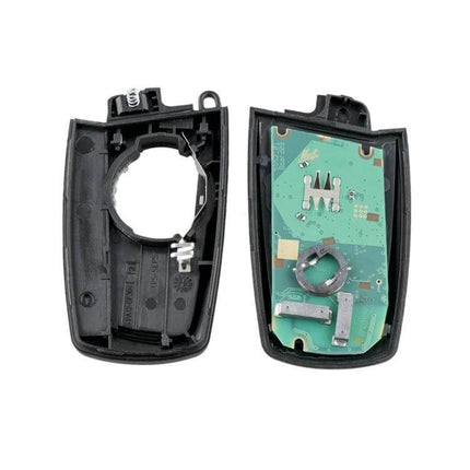 Complete BMW CAS4 Remote Car Key with Integrated Battery and Chip showing opened key shell and circuit board for replacement and programming