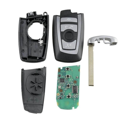 Complete BMW CAS4 Remote Car Key with Integrated Battery and Chip - disassembled key shell, circuit board and emergency blade