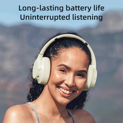 Zealot Foldable On Ear Wireless Headphones For Commuting And Calls worn by smiling commuter outdoors showcasing foldable on-ear design