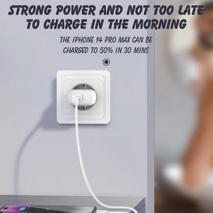 LDNIO USB-C Charger for Everyday Home and Travel Use plugged into wall socket charging smartphone on bedside table