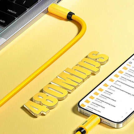 WK Silicone Type-C Cable for Daily Device Charging - flexible yellow silicone cable charging phone and laptop on desk