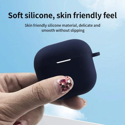 Silicone Case Keeps Earphones Secure for Daily Activities — Dark blue soft silicone case held between fingers, protects against scratches and dust
