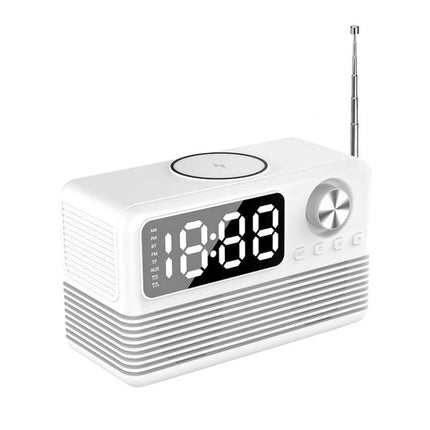 Compact white Bedside Speaker With LED Clock And Wireless Charging Pad showing LED display, dial, buttons and telescoping antenna