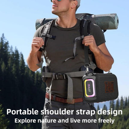 Zealot Portable Bluetooth Speaker For Travel And Outdoor Use clipped to backpack strap during a day hike