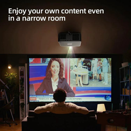 AUN Home Theater Projector with Smart Features for Family Viewing projecting a Full HD movie on a large screen in a cozy living room