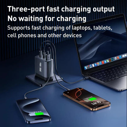 REMAX Charger for Daily Device Powering at Home or Travel showing compact 100W GaN three-port charger powering laptop and two smartphones