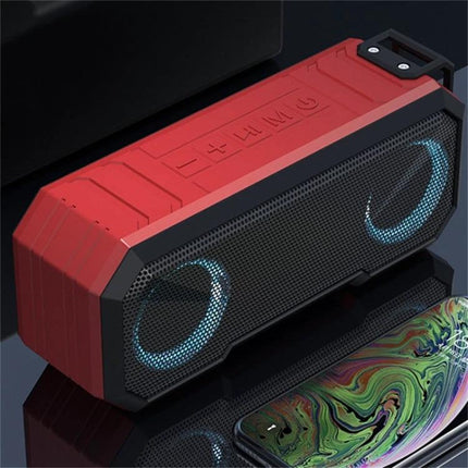 Waterproof Portable Bluetooth Speaker For Beach Camping And Backyard red rugged IPX7 speaker with LED rings near smartphone