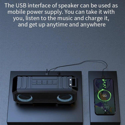 Waterproof Portable Bluetooth Speaker For Beach Camping And Backyard charging a smartphone via USB while playing music outdoors
