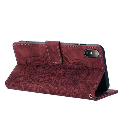 Mandala Embossed Leather Case With Card Slots in burgundy folded as kickstand showing embossed mandala and wrist strap