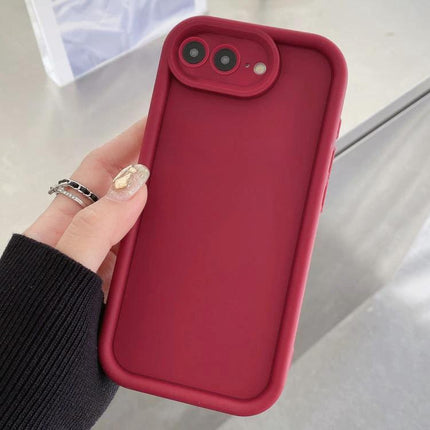 Daily Phone Case For Everyday Use - slim red flexible TPU protective phone case with raised edges for screen and camera, held in hand