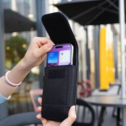 Universal Vertical Outdoor Phone Waist Bag for Up to 7-Inch Phones showing black nylon vertical waist pouch with smartphone being inserted, hands demonstrating use
