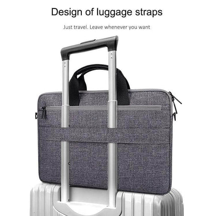 Handheld Nylon Laptop Carrying Case for Up to 15.6-Inch Devices shown attached to suitcase handle with luggage strap