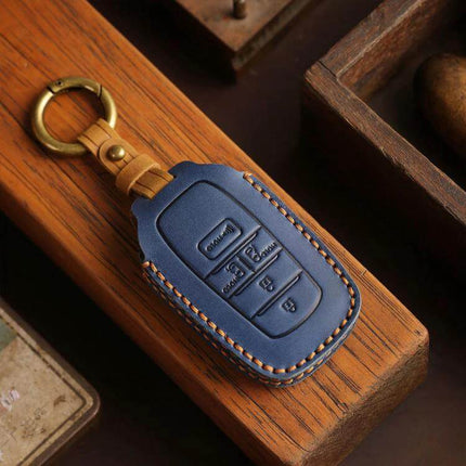 Cowhide Key Cover For Toyota Sienna Four To Six Button in navy blue leather protecting 4-6 button fob with brass keyring
