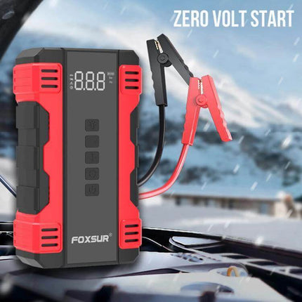 FOXSUR Portable Emergency Car Starter with Air Pump shown on a car hood with clamps and digital display for roadside jump-starts and tire inflation