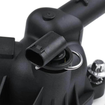 Opel Thermostat Housing Water Pump Outlet Direct Fit Replacement close-up of black plastic thermostat housing with electrical connector and mounting point