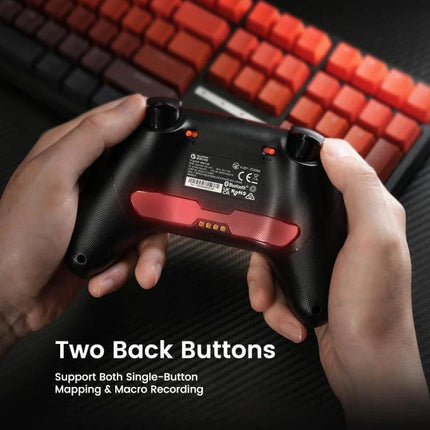 GameSir Controller for Everyday Gaming on PC and Mobile showing hands holding black controller with two back buttons and red keyboard background