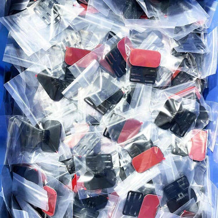 Universal Adhesive Mounting Bracket for Car Rear Cameras in clear packaging showing red-backed adhesive clips for rear camera installation