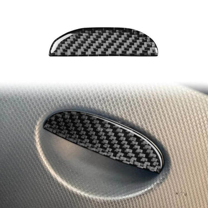 Carbon Fiber Car Seat Storage Box Handle Decorative Sticker installed on SEAT Leon seat showing carbon fiber texture and protective finish