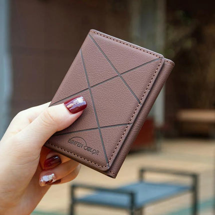 Diamond Embossed Magnetic Leather Card Bag for Cards and Phone Holder in brown leather held showing diamond embossing and compact card organizer