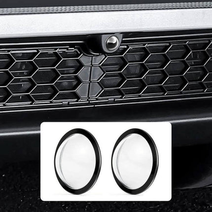 Lens Guard Protective Cover Kits for Tesla Vehicles shown installed over front camera lens on Tesla grille, precise fit for Cybertruck and Model S (front view)