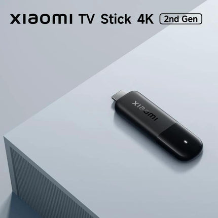 Xiaomi 4K Ultra HD TV Stick for Streaming Video Content at Home compact HDMI Google TV streaming device on table