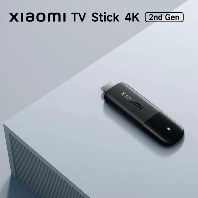 Xiaomi 4K Ultra HD TV Stick for Streaming Video Content at Home compact HDMI Google TV streaming device on table