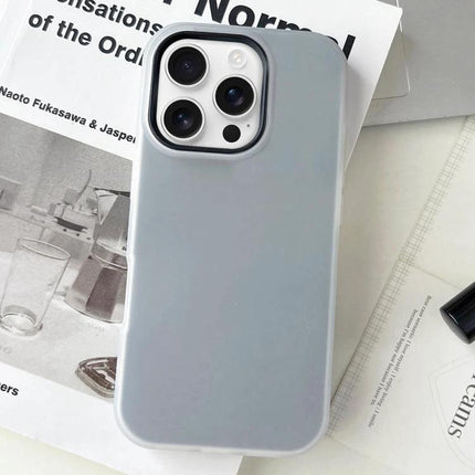 Essential iPhone Case for Everyday Use slim gray protective case with raised edges shown on magazine background