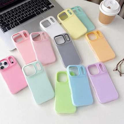 Daily Protective Case For iPhone Slim Design in pastel colors laid out on a desk next to laptop and coffee, slim lightweight everyday protection